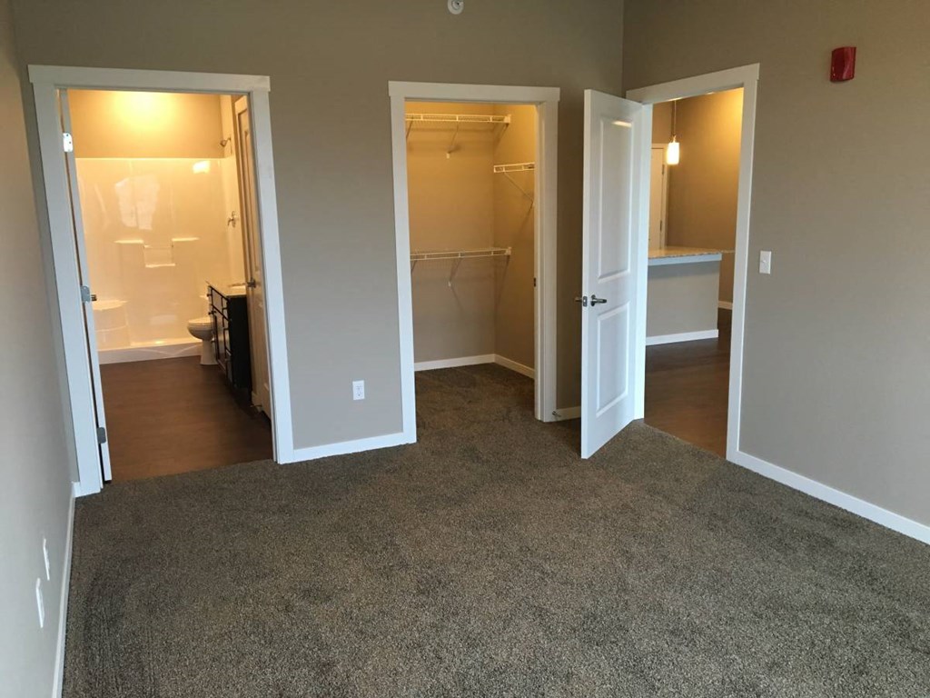 Bedroom With Closet Bedroom With Closet at Courtyard Apartments, Moorhead, Minnesota