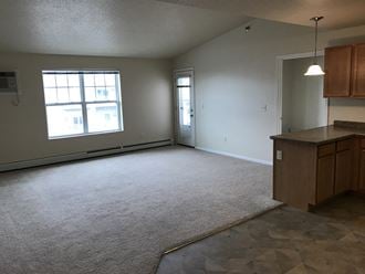 Carpeted Living Room at Boulder Ridge Apartments, Fargo, 58104