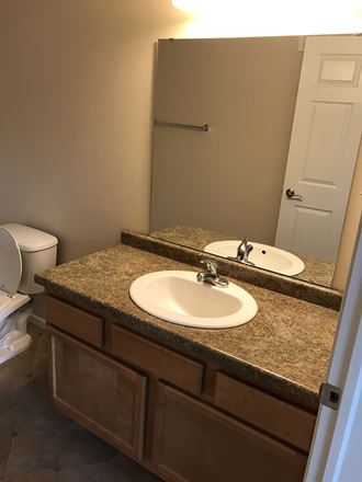 Renovated Bathrooms With Quartz Counters at Boulder Ridge Apartments, North Dakota