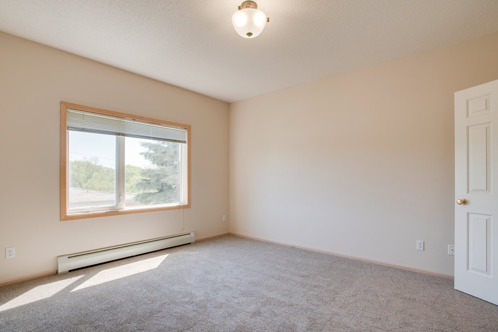 A room with a window and a door. at Eighth Street Manor  Apartments, Fargo, ND