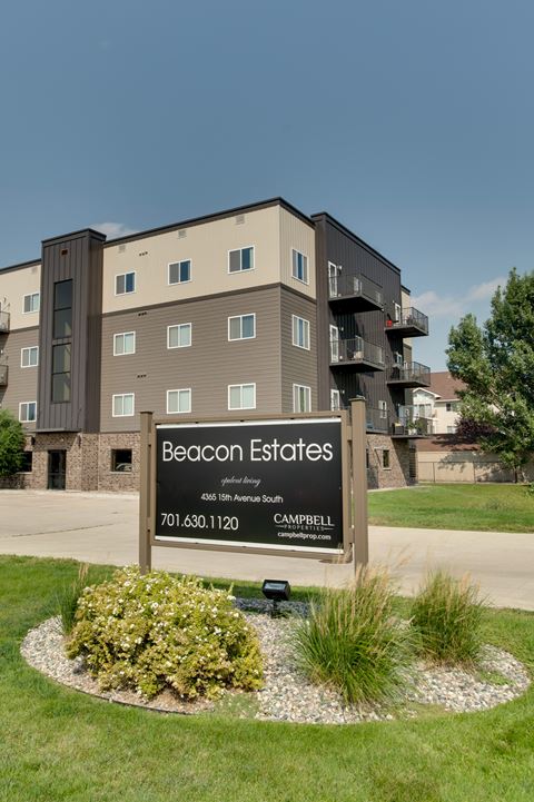 a building with a sign that says beacon estates