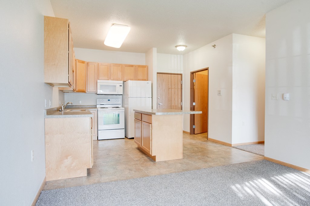 Kitchen with white appliances at Lakestone Apartments, Moorhead, MN