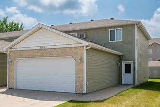 a house with a white garage door