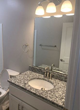 Bathroom With Vanity Lights at Warehouse Apartments, Fargo, North Dakota