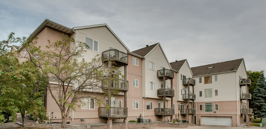 A large apartment complex with multiple balconies and garages, Eighth Street Manor  Apartments, Fargo, ND