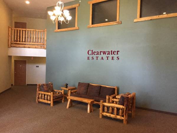 a living room with a couch and chairs