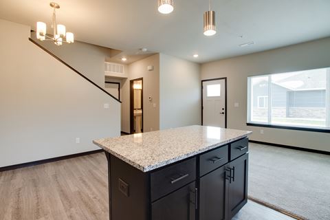 Kitchen with a granite counter top in a new home