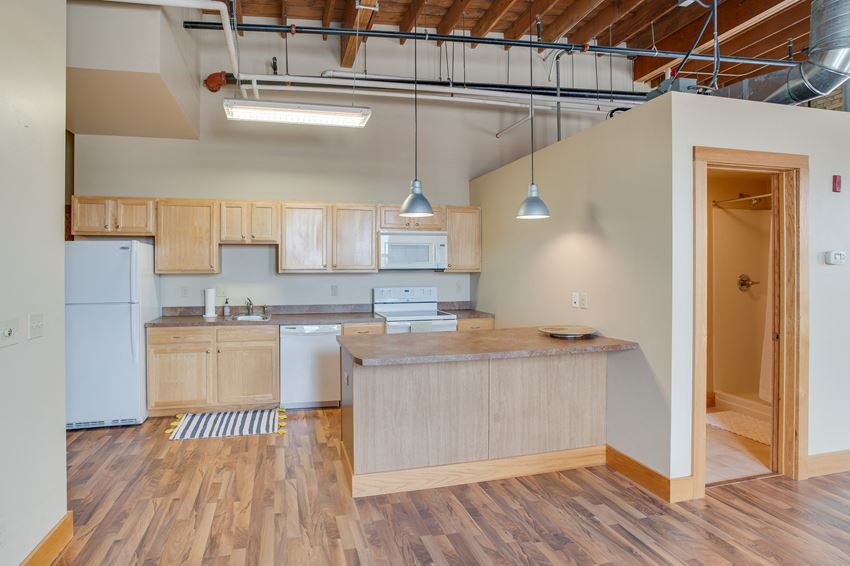 an open floor plan with a kitchen and living room