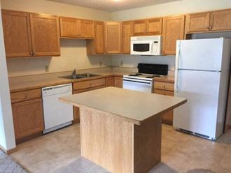 Kitchen with cabinets at Clearwater Estates Apartments, Baxter, 56425