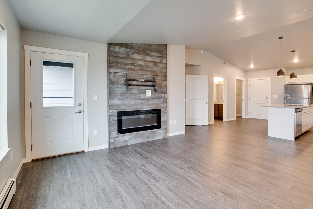 Living room with fireplace at Mezzo Apartments, Fargo, ND