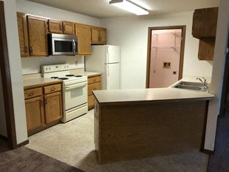 Fully Furnished Kitchen at Bluemont Village Apartments, North Dakota