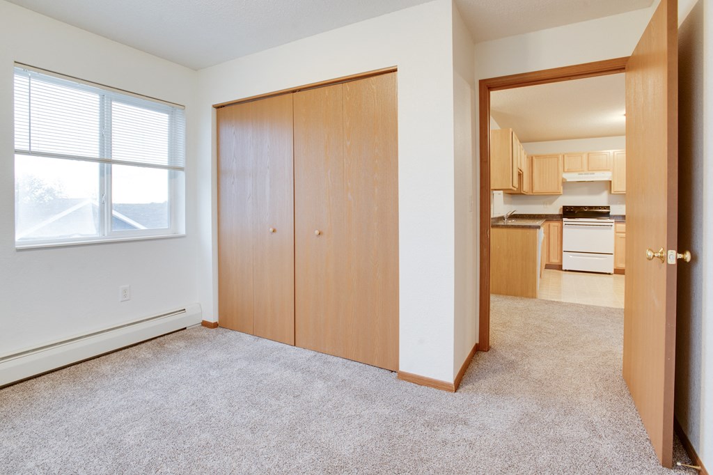 Bedroom with a closet at Pelican Heights Apartments, MN, 56501