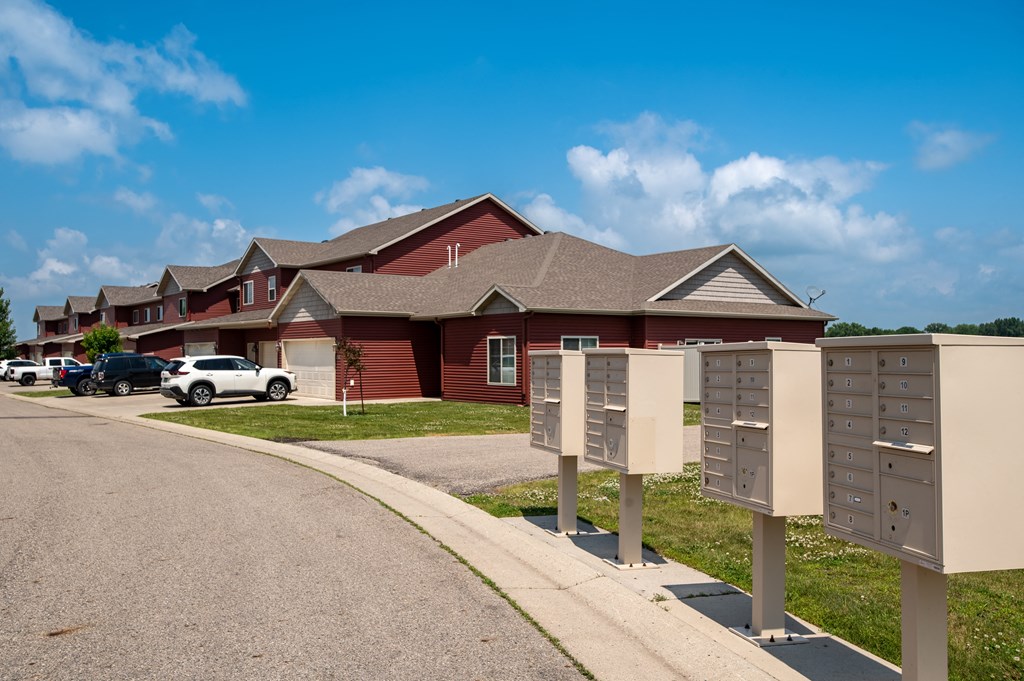 a house with three mailboxes in front of it