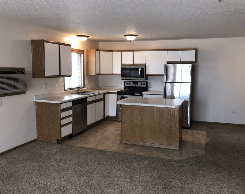 A kitchen with a sink, stove, and refrigerator, Royal Oaks Apartments, ND