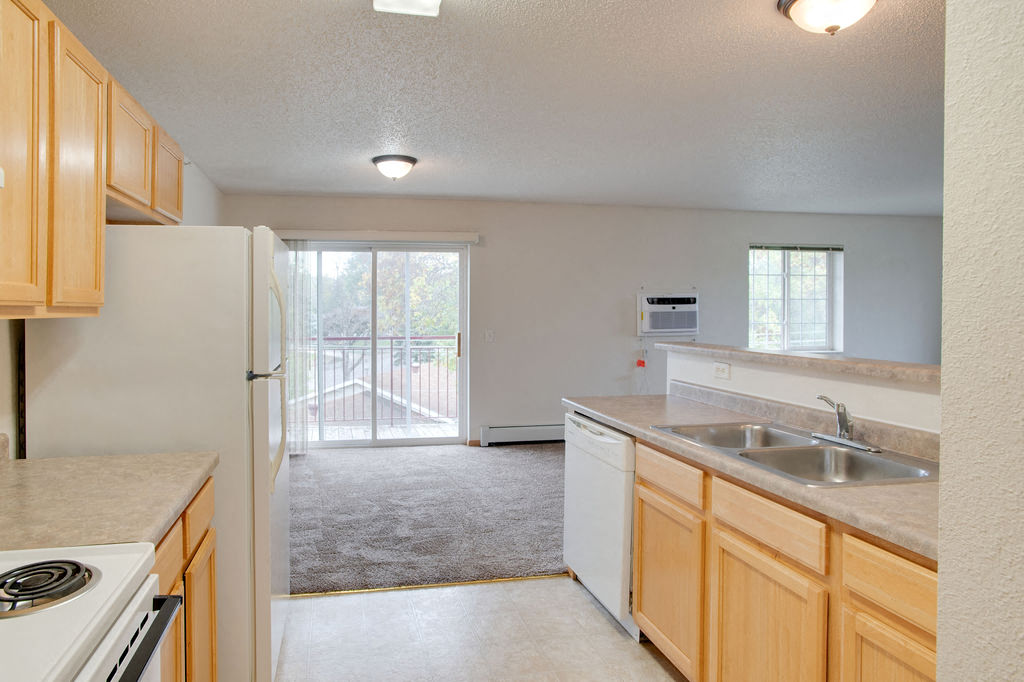 a kitchen with a sink and a refrigerator