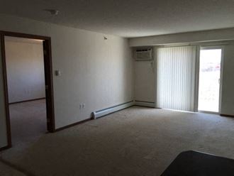 Carpeted Living Room at Pelican Heights Apartments - Detroit Lakes, Minnesota, 56501