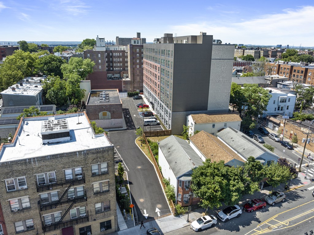 an aerial view of a city with buildings and trees