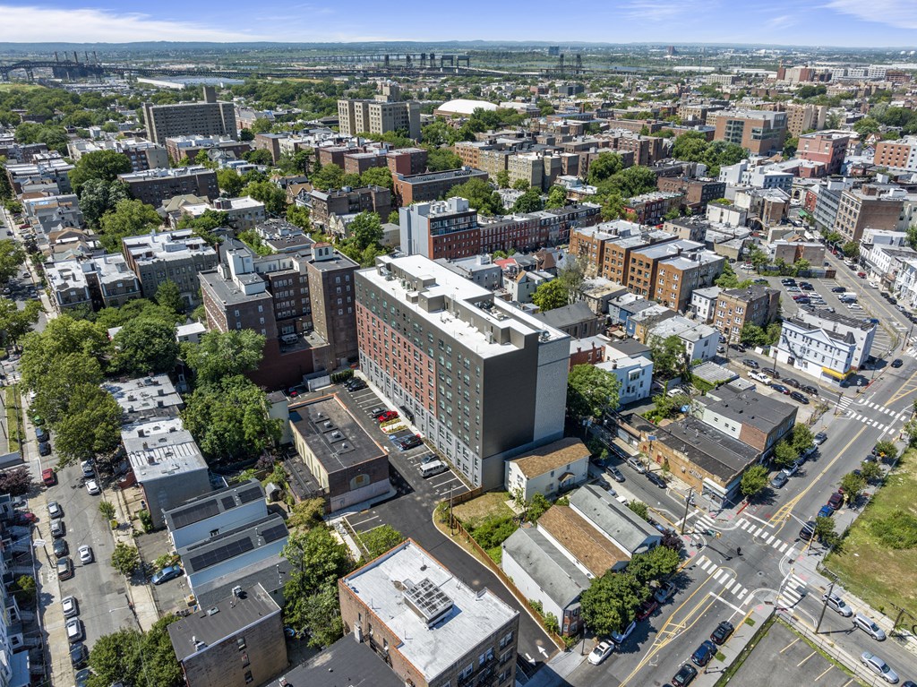 an aerial view of a city with buildings and cars