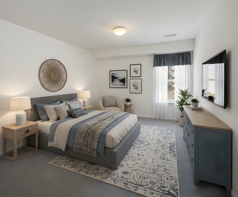 A bedroom with a large bed and a wooden nightstand.
