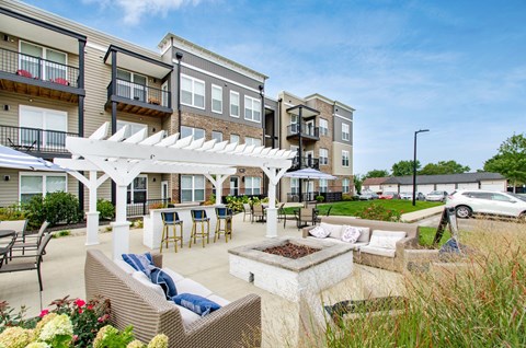 A sunny day at a residential outdoor patio with a white pergola.