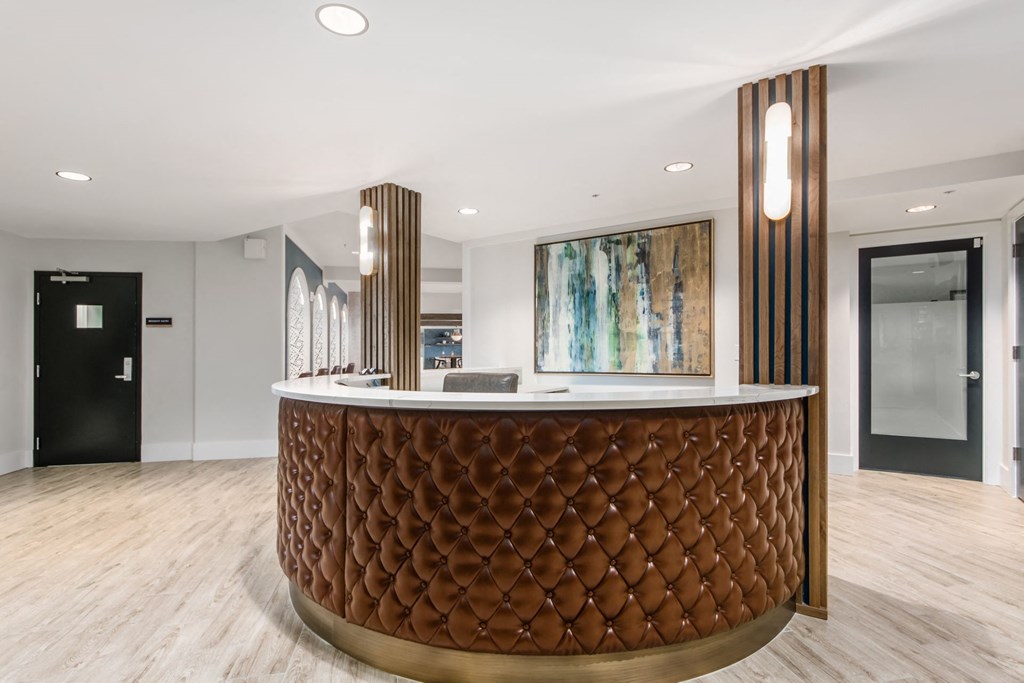 the lobby or reception area of a hotel with a reception desk