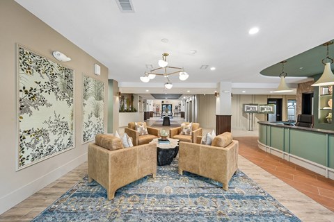A living room with a sofa set and a rug.