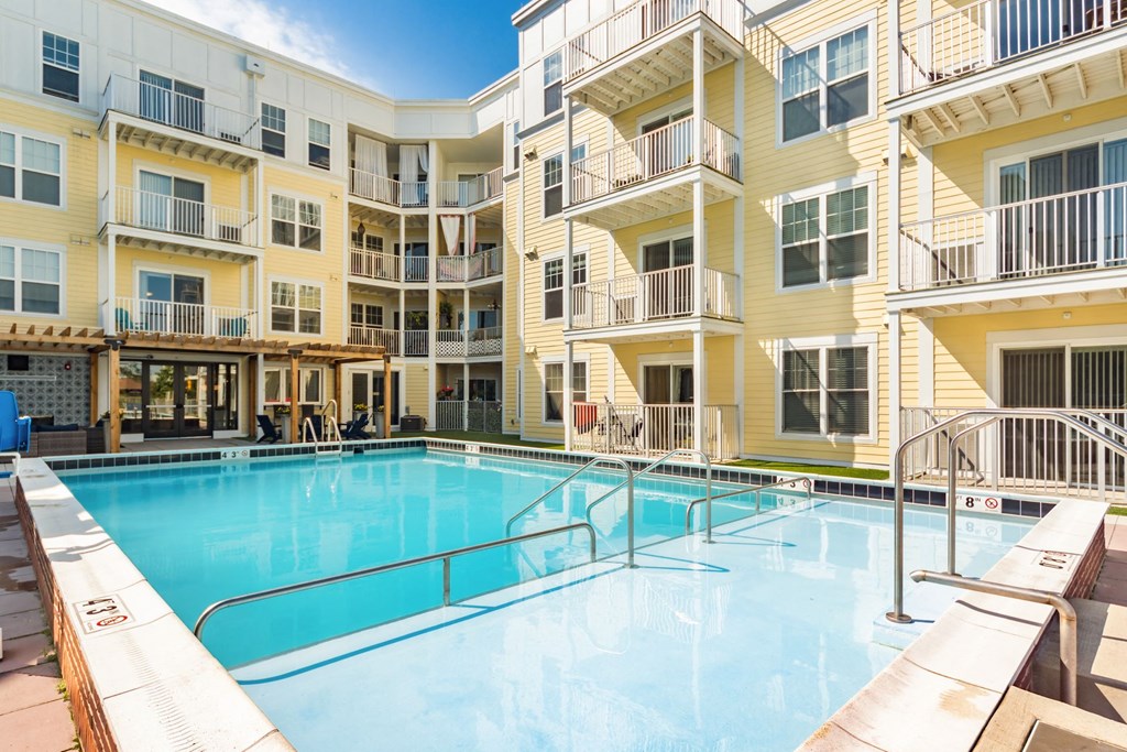 a swimming pool in the middle of an apartment building