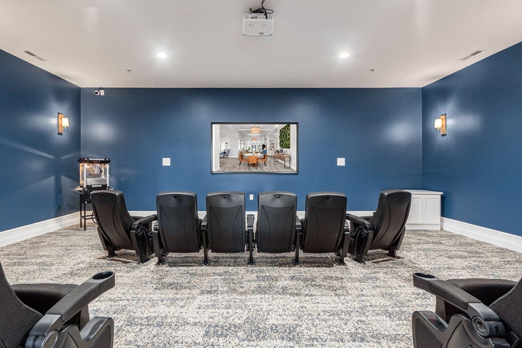 a conference room with blue walls and a table and chairs
