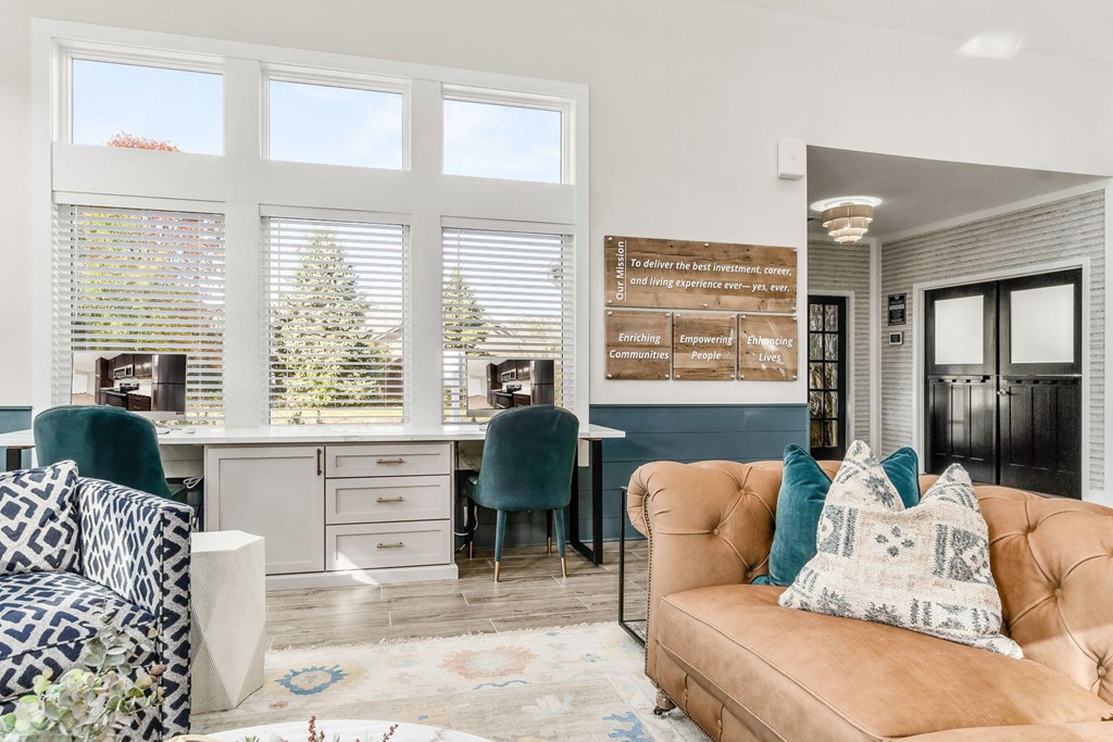 a living room with a couch and a table with chairs