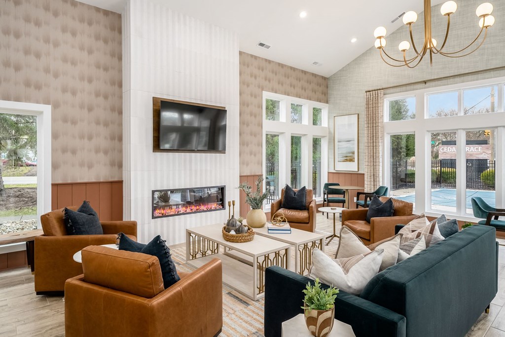 a living room with couches and chairs and a fireplace