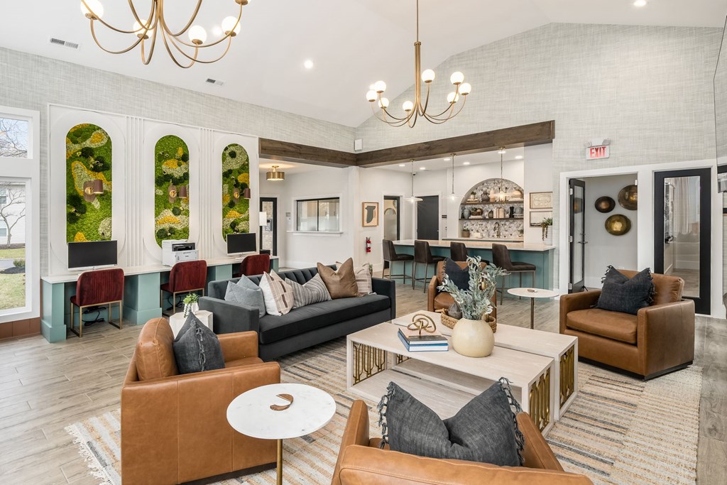 a living room with couches and chairs and a table