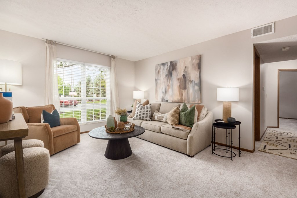 a living room with couches and a table