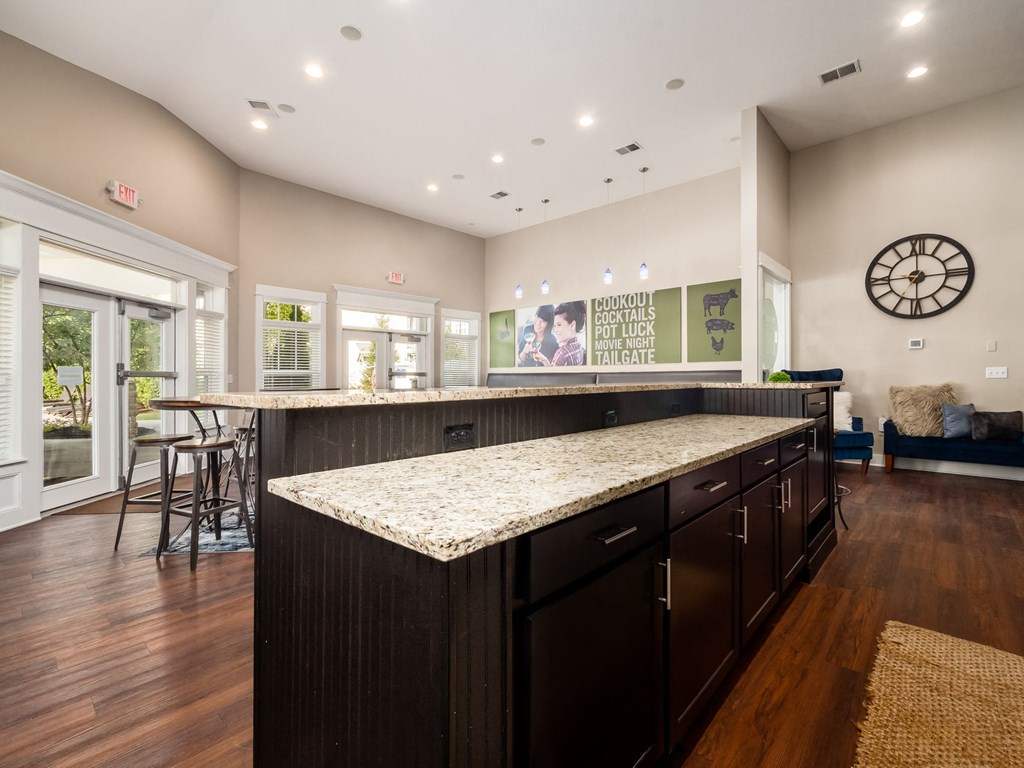 a large kitchen with a counter top in a house