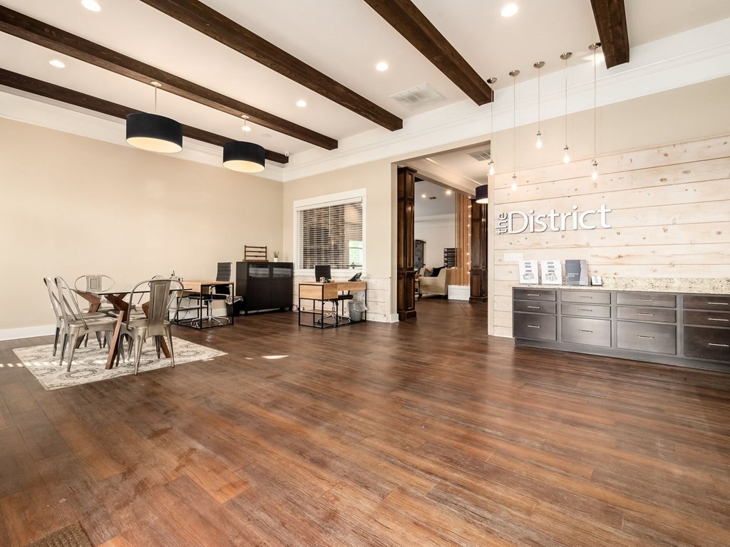 a dining room with a table and chairs in a room with wood floors