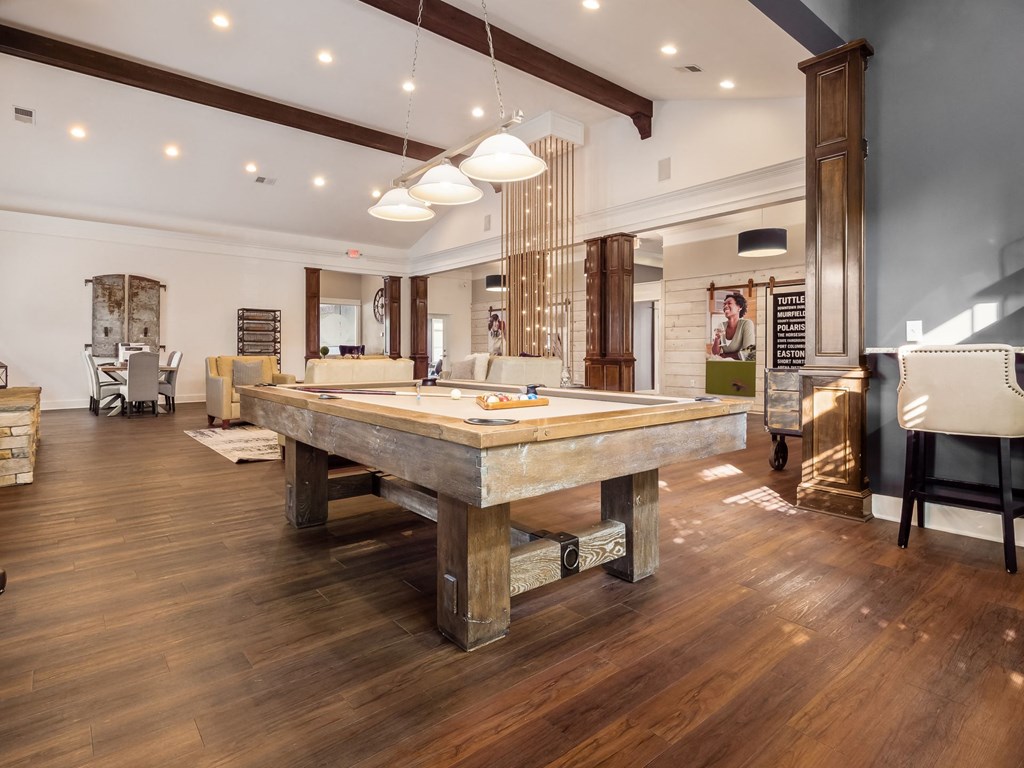 a pool table in the middle of a living room