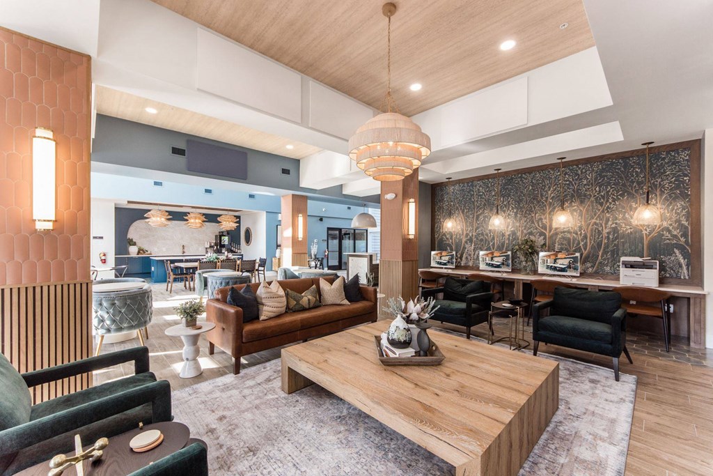 a lobby with couches and chairs and a coffee table