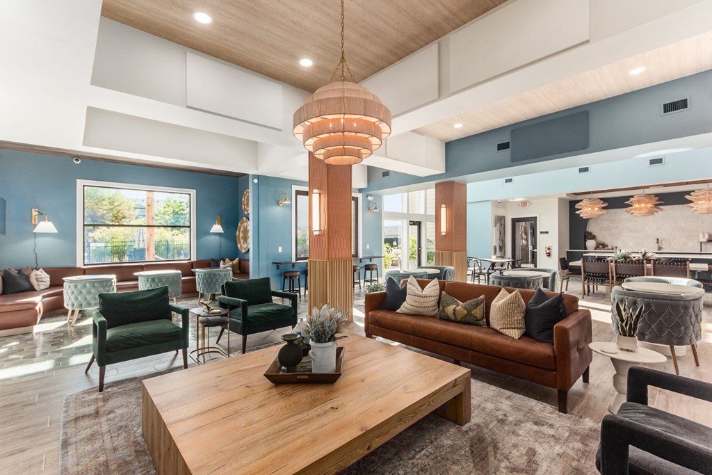 a living room with couches and chairs and a table