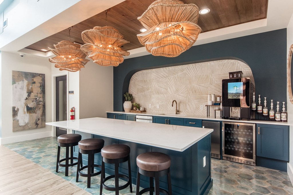 a kitchen with a counter and bar stools