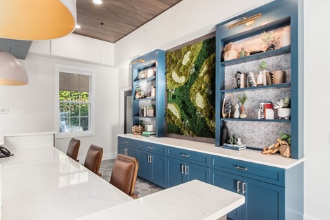 a kitchen with blue cabinets and a white counter top
