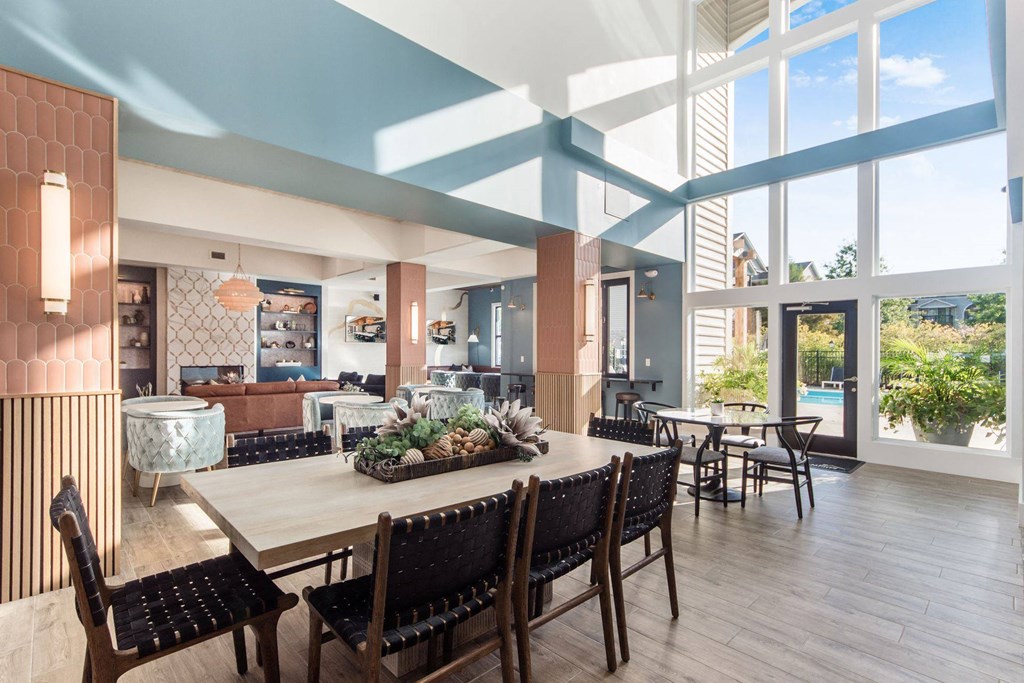 a dining room with a large table and chairs