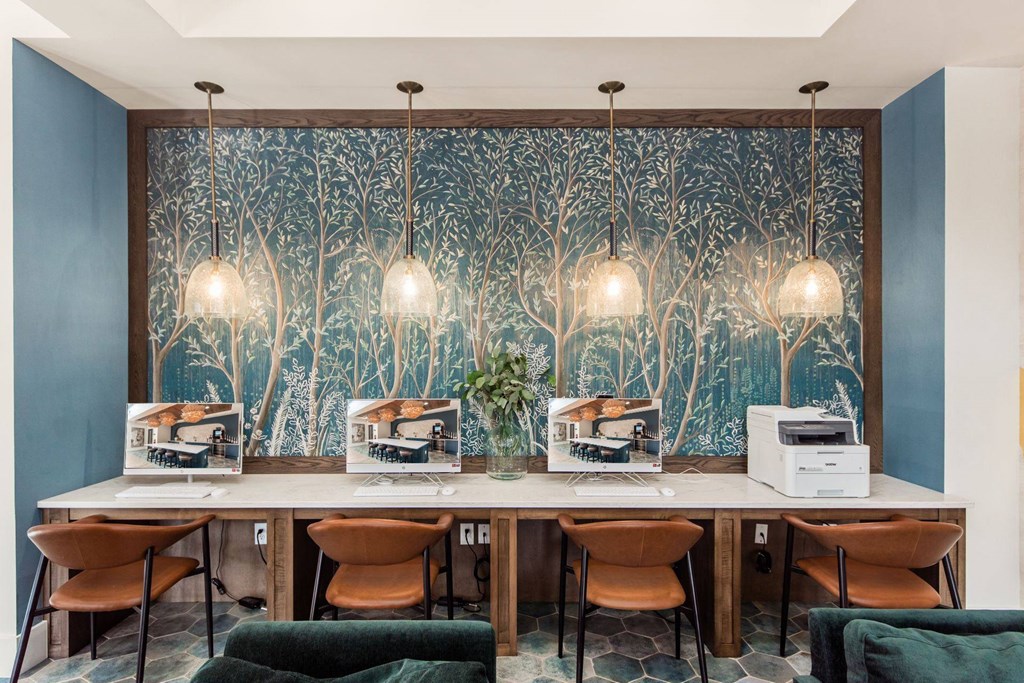 a dining room with a long table and chairs