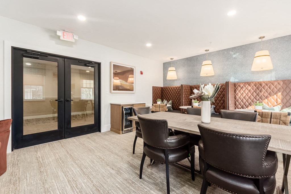 a dining room with a table and chairs