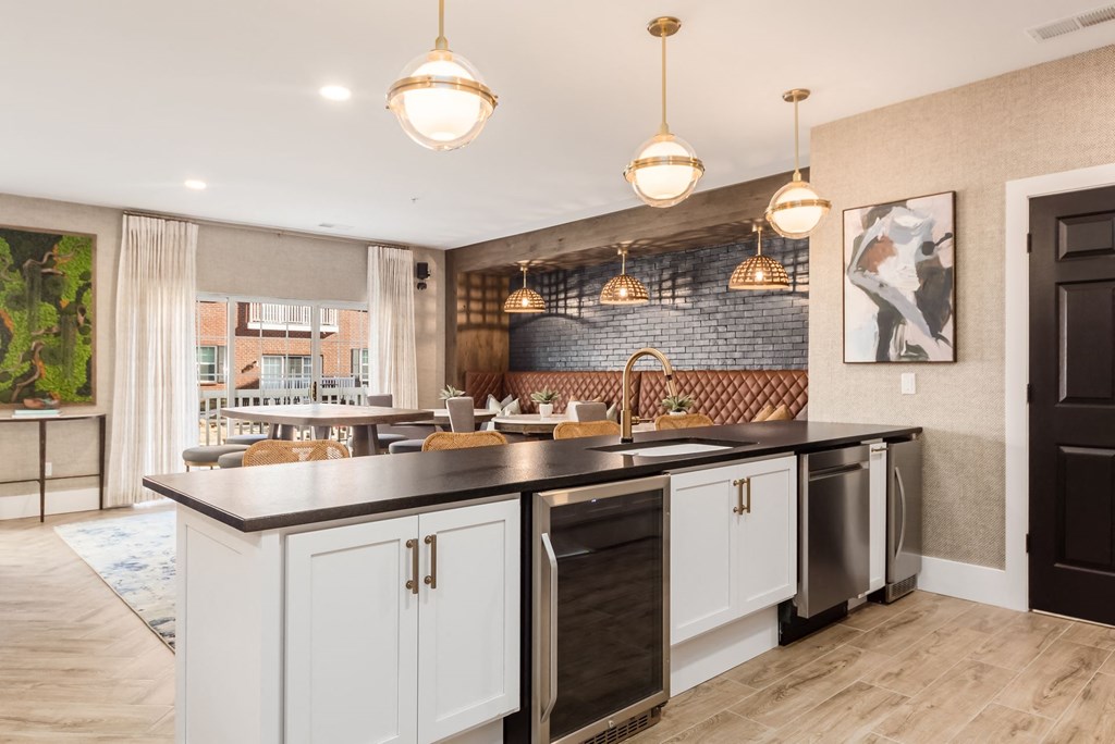 a kitchen with a large island and a dining room
