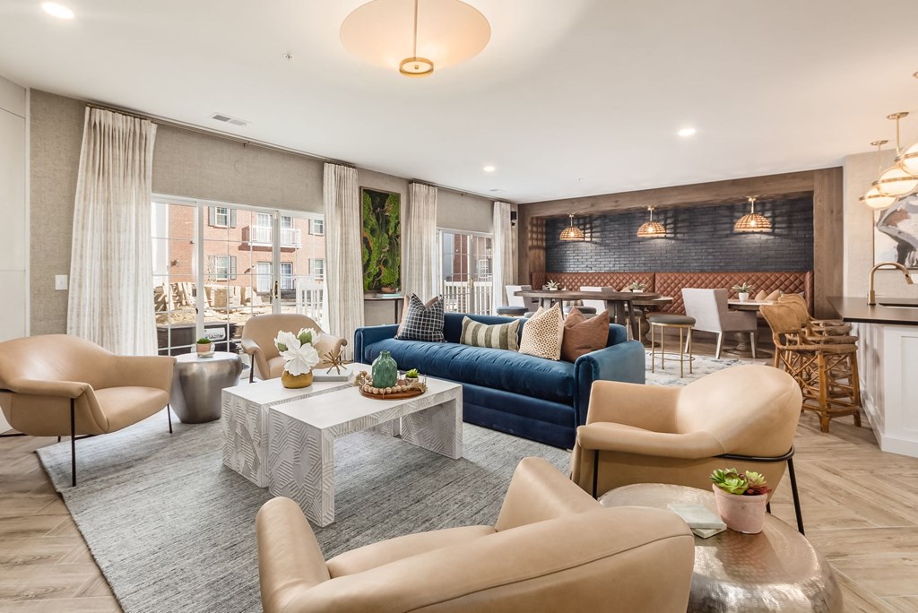 a living room with couches and chairs and a table