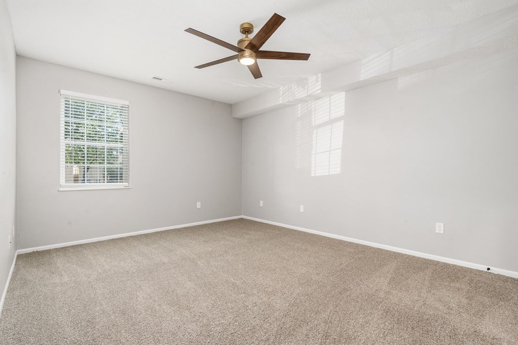 Residences of Gahanna main bedroom with new flooring, paint and modern new ceiling fan