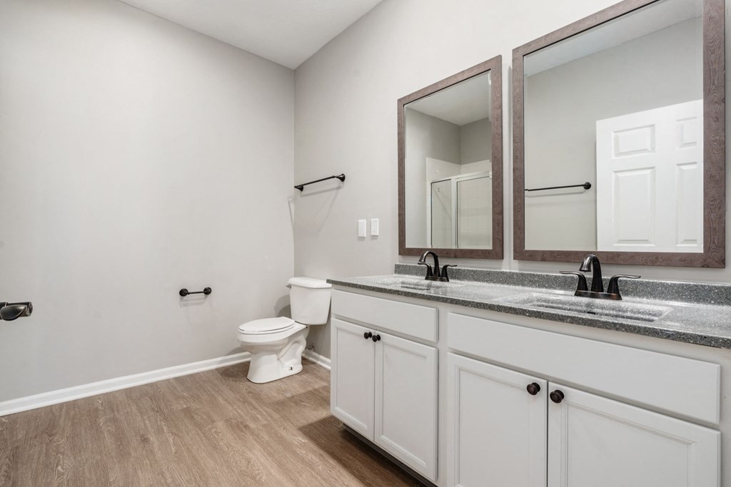 Residences of Gahanna newly renovated main bathroom with new flooring, countertops, double vanity and modern black finishes