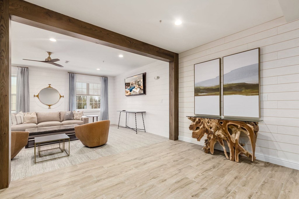 a living room with a couch and a mirror