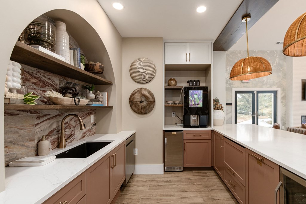 a large kitchen with a sink and counter top