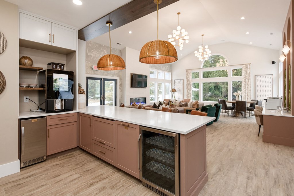 a large kitchen with an island in the middle of it