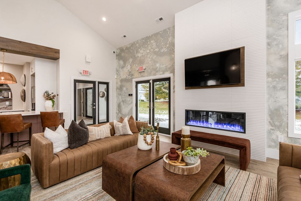 a living room with a couch and a fireplace